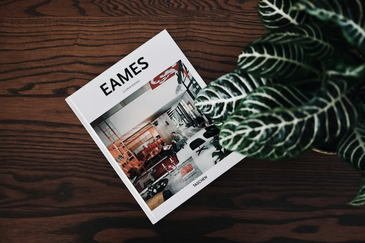 Eames book on a wooden table