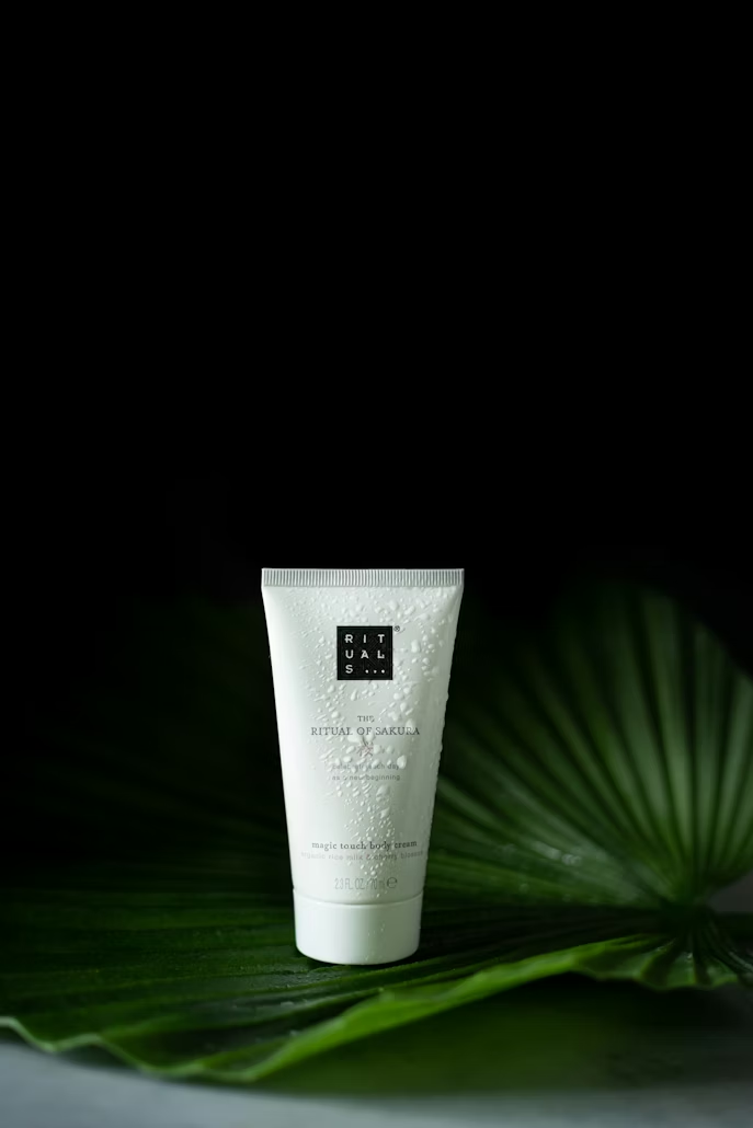 Cosmetic product photographed on green leaves