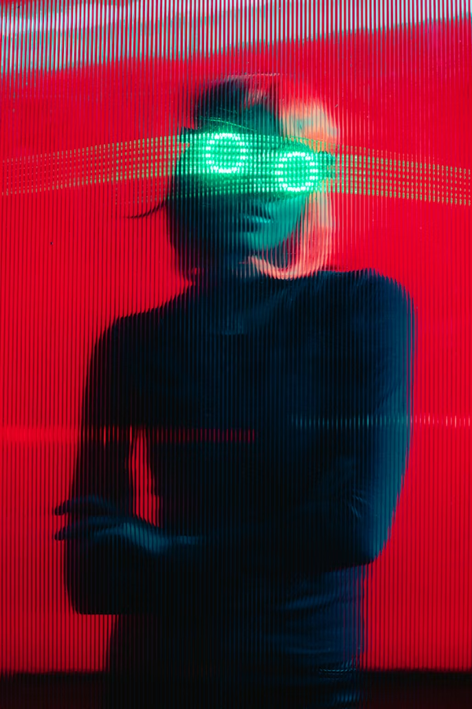 Portrait lit with red and cyan neon